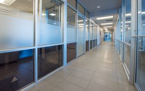 Hallway with glass door offices at Calgary Motor Products.