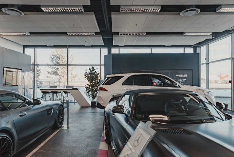Showroom with three cars at Lonestar Mercedes-Benz.