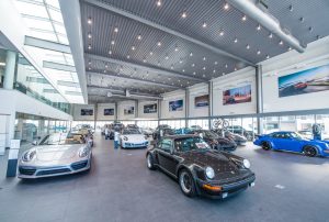 Showroom with cars at Porsche Centre Calgary.