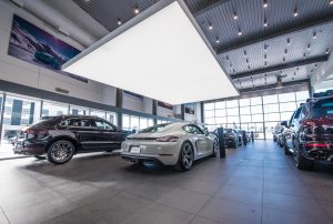Showroom with cars at Porsche Centre Calgary.