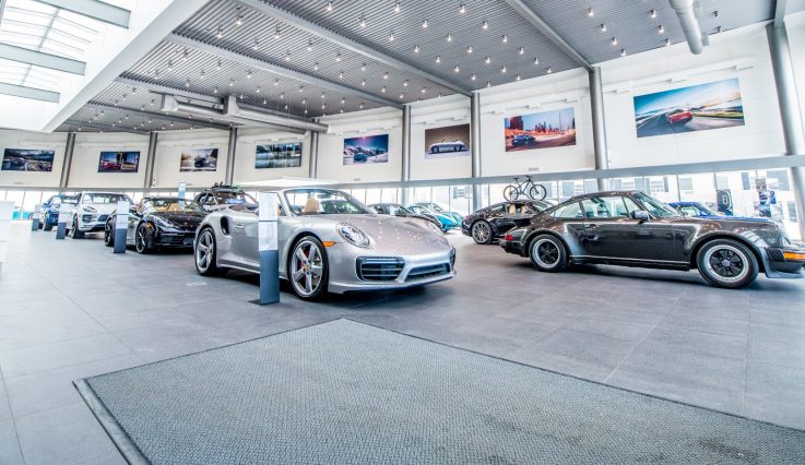 Porsche Centre Calgary showroom with multiple Porsche.