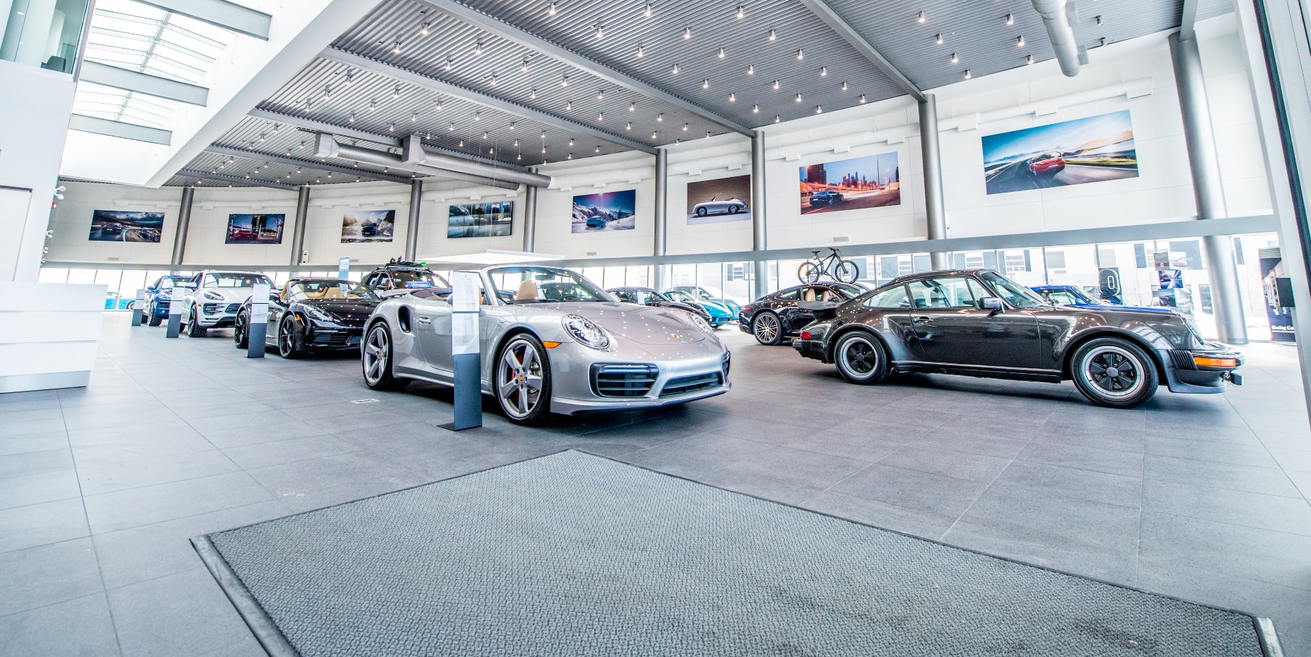 Porsche Centre Calgary showroom with multiple Porsche.