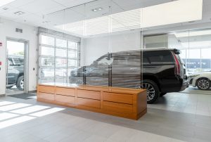 Showroom area with black SUV at Carter Cadillac.