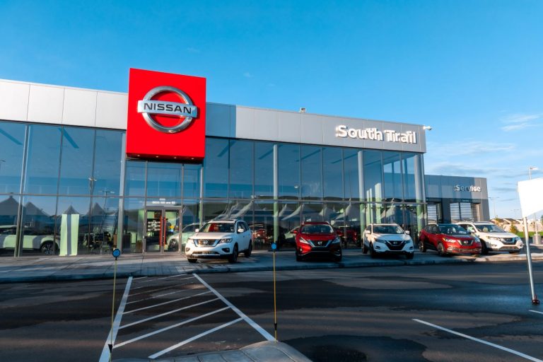 Parking lot view of South Trail Nissan Dealership.