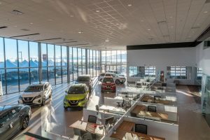 Overview shot of sales desks and cars at South Trail Nissan.