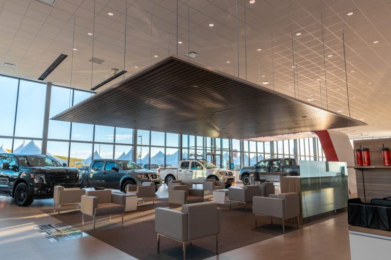 Customer lounge surrounded by trucks at South Trail Nissan.