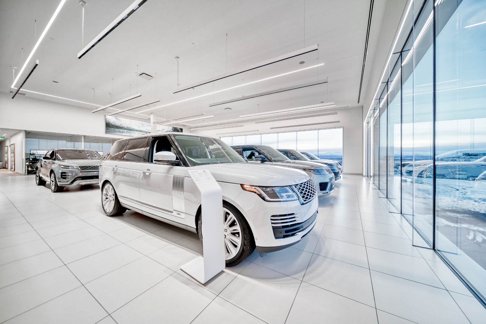 Showroom with white SUV at Jaguar Land Rover