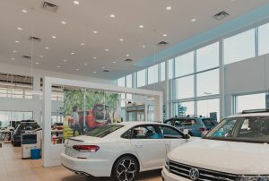 Showroom with two white Volkswagens at Fifth Ave Volkswagen.